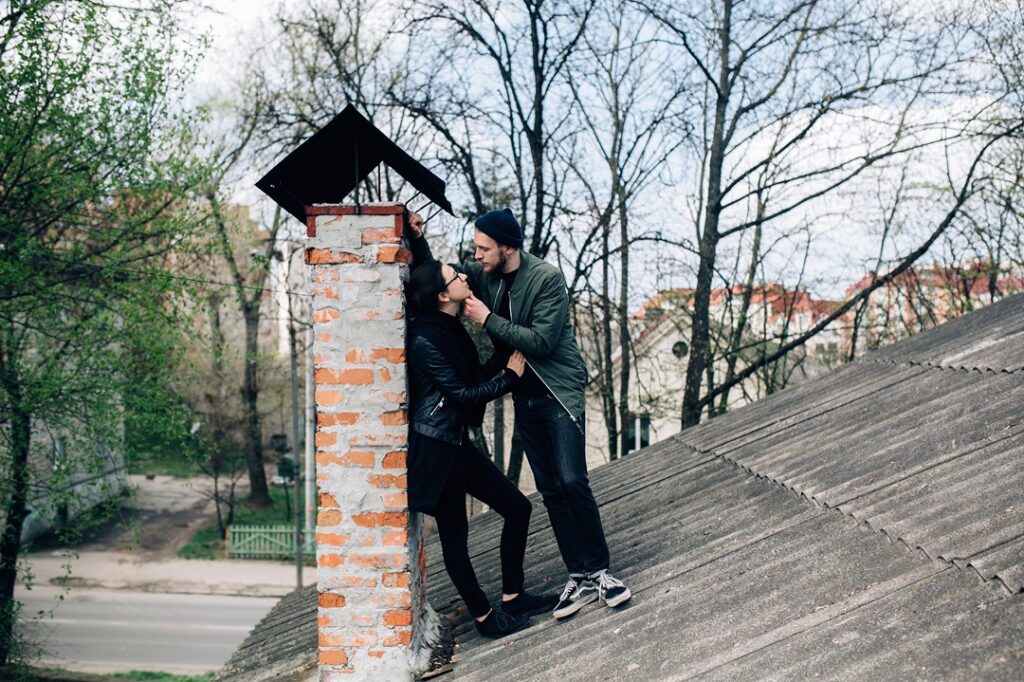 romantic-couple-flirting-roof